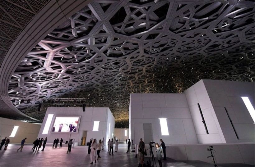 The domed roof of Louvre Abu Dhabi, where architectural metal and painted finishes were restored before opening.
